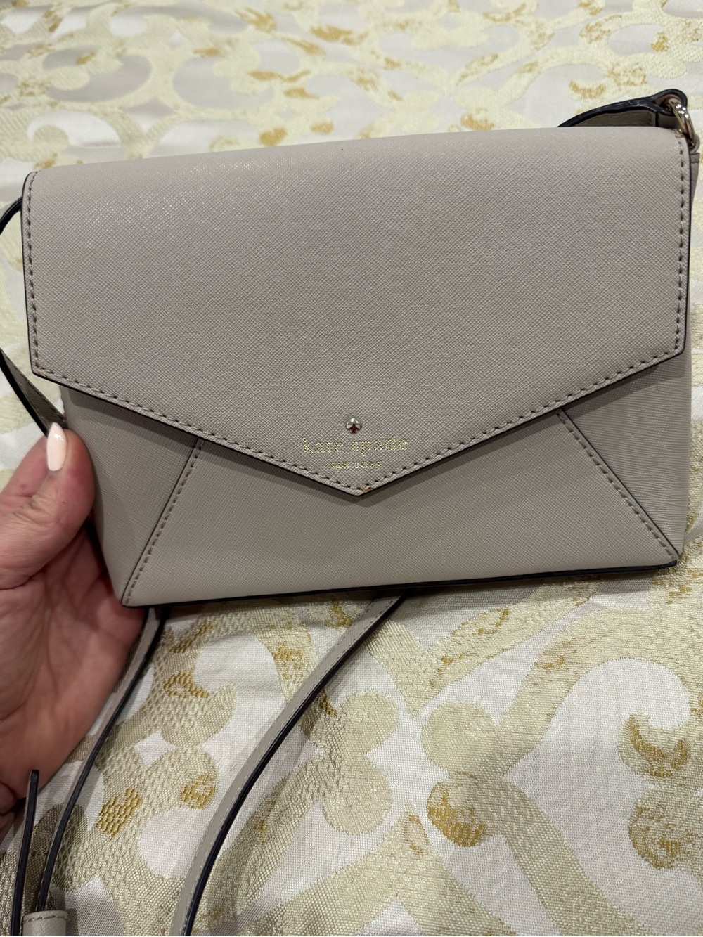 kate spade gray envelope crossbody with gold logo